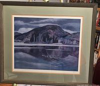 Full view of the framed lithograph print depicting a mountain and lake scene with cloudy sky.