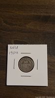 Reverse side showing denomination 10 cents, year 1904, and 'Newfoundland' inscription on silver dime.