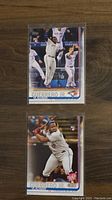 Front view of two Vladimir Guerrero Jr rookie baseball cards showing action shots, one batting and one playing defense.