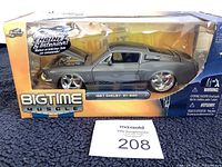 Front side view of the 1967 Shelby GT-500 diecast model in packaging showing box branding and car details.