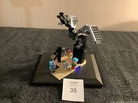 Lego Minecraft set 21151 featuring large Ender Dragon figure and four mini-figures on base plate