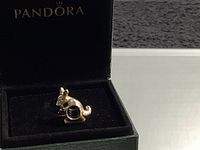 Silver-tone kangaroo Pandora charm displayed in open box, showing front angle.