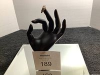 Ring worn on black display hand to show size and shape.