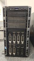 Front view of Dell PowerEdge T620 server showing drive bays, DVD drive, front panel USB ports, power button and display screen.