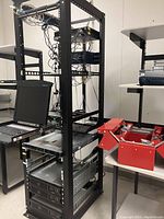 Full view of rack with patch panel, servers, UPS and KVM console installed