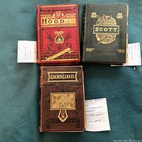 All three vintage Lansdowne Poets books - Hood, Scott, Golden Leaves, shown together on blue cloth background with handwritten note.