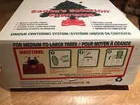 Original box label showing Santa Solution Supreme branding and directions for use for medium to large trees.