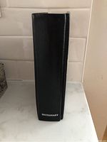 Side view of dictionary spine stamped with 'DICTIONARY'