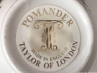 Close-up of the bottom seal showing the branding: 'Pomander, Made in England, Taylor of London'.