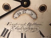 Close-up photo of the clock face showing the 'Frederick Bellone, Shaftesbury' script and date aperture