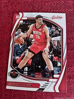 Front of the basketball card, showing Alperen Şengün in Houston Rockets uniform with rookie badge and design accents in red and white.