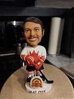 Front view of the Brad Park bobblehead figurine showing detailed facial features, jersey, and base with name and logo.
