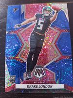 Front of Drake London rookie card showing holographic mosaic design, player image, and logos.