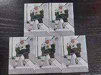Five 2006/2007 SP Authentic Eric Lindros hockey cards front view arranged on dark surface.