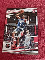 Front side of the Jalen Green basketball rookie card showing the player in action in Houston Rockets uniform, card number, and Prestige branding.