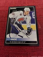 Clear photo of Joe Sakic Quebec Nordiques hockey card by Pinnacle, showing front side with player image and branding.