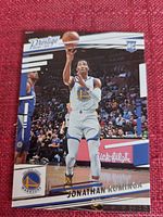 Front side of Jonathan Kuminga rookie card showing player action and branding