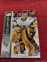 Close-up image of Upper Deck Marc-Andre Fleury hockey card showing Fleury in Golden Knights goalie uniform with yellow pads and gloves, card in excellent condition with clear image and visible logos.
