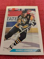 Front image of Mario Lemieux hockey card by Bowman, featuring Lemieux skating in Penguins jersey.