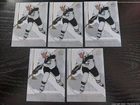 Front side of five identical Mario Lemieux hockey cards featuring Pittsburgh Penguins jersey action shot.