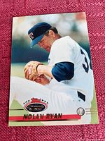 Clear image of the Nolan Ryan baseball card showing front design with action shot and logo.
