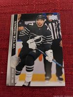 Victor Hedman Upper Deck NHL All-Star hockey trading card showing player in action wearing black jersey with number 77.