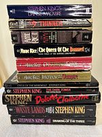 Stack of 11 paperback books by Stephen King and Anne Rice showing titles and condition