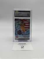 Front view of LeBron James reactive blue holographic basketball card in slab with label.