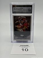 Front view of slabbed card showing CSG slab and card label
