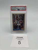 Front view of the 1992 Topps Shaquille ONeal rookie card in PSA graded slab showing card number, grade, and player image.