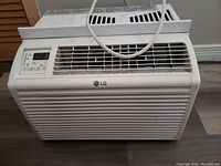 Front view of LG window air conditioner showing vents and LG logo