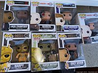 Full set of seven boxed Funko Pop figures showing front of packaging and character visibility.