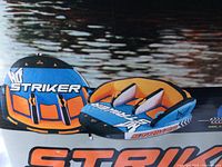 Front of retail box showing Striker towable tube design and color