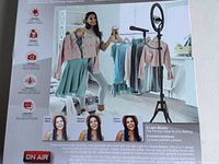 Box image showing a woman using the Halo Light Pro kit setup with ring light, microphone, smartphone holder on tripod stand in a studio setting.