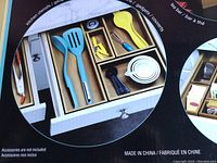Photo of bamboo organizer boxes in use with kitchen utensils and tea items, showing compartments and size variety.