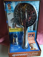 New PowerPulse UltraThin shower head displayed in its packaging with visible 5 sprays icon and PowerComb technology details.