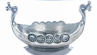 Pewter Viking dragon ship shaped salt cellar showing side profile and shield decorations along hull