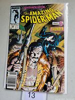 Front cover of Amazing Spider-Man #294, showing Spider-Man in black and a man with a spear in a wooden environment.