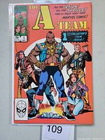 Front cover photo showing The A-Team #1 Marvel Comic book with Mr. T and team members on orange background.