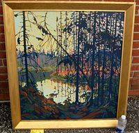 Full frontal view of framed silkscreen print against brick background