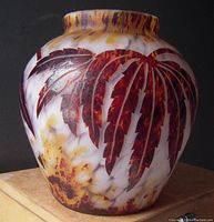 Side view of cameo glass vase showing etchings and frond details.