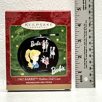 Photo of the 1962 Barbie Hatbox Doll Case ornament box with a ruler next to it showing the size of about 4 inches.