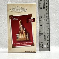 Photo of the ornament box showing the product image and dimensions next to a ruler