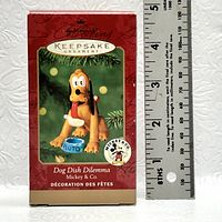 Photo of the Hallmark Keepsake Ornament box showing front design, item title, and a ruler indicating approximately 5 inches in height.