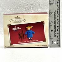 Hallmark Keepsake ornament box showing Madeline and Genevieve set with a ruler for size reference.