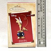 Original packaging of Tinker Bell Hallmark Keepsake Ornament with a ruler for size reference
