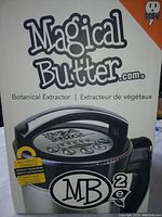 Photo of the Magical Butter MB2e Botanical Extractor box showing the product image, logo, and 110V power rating.