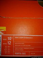 Photo of the Nike shoe box label showing size and model information.