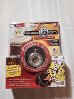 Front side of original sealed packaging showing Kansas City Railroad Pocket Watch with visible watch face, chain, and branding details.