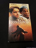 Front cover of The Shawshank Redemption VHS tape sleeve with image of Tim Robbins and Morgan Freeman